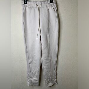 Zella cute cream stretchy pants with zipper design size:M